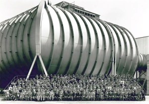 Group seated in front of wind tunnel.