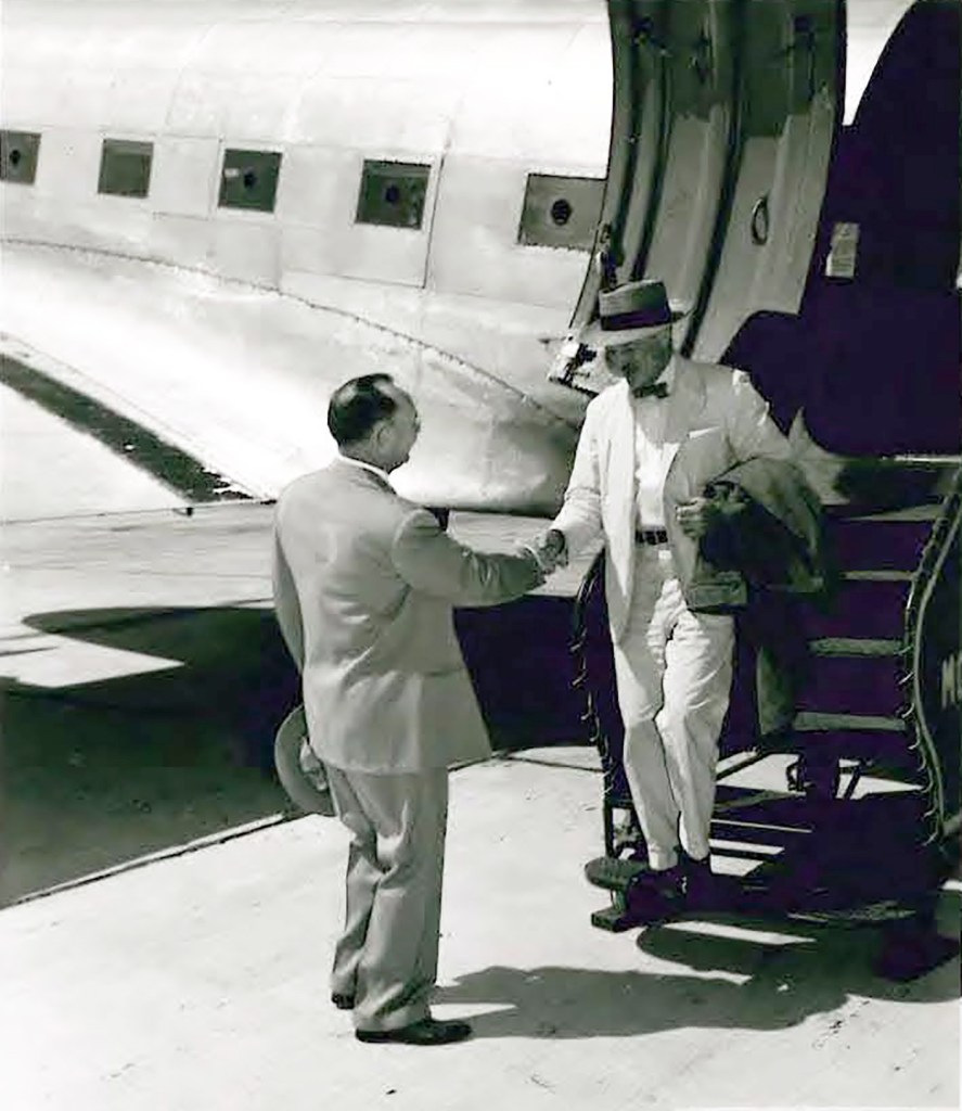 Man getting off airplane.