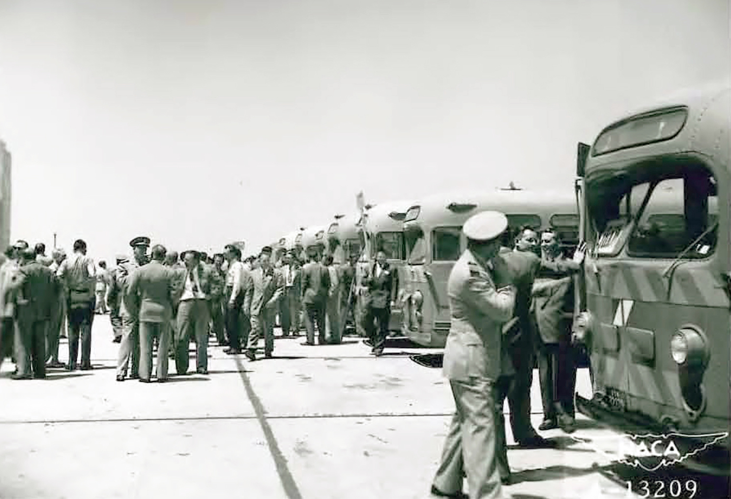 People exiting buses.