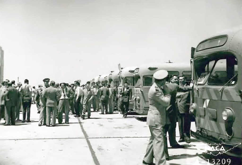 People exiting buses.