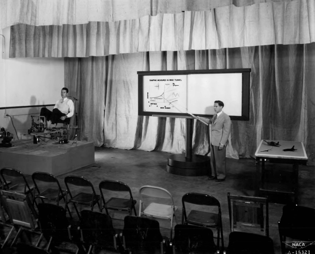 Man pointing to display.