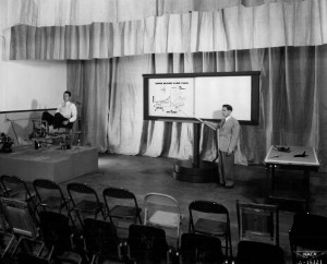 Man pointing to display.