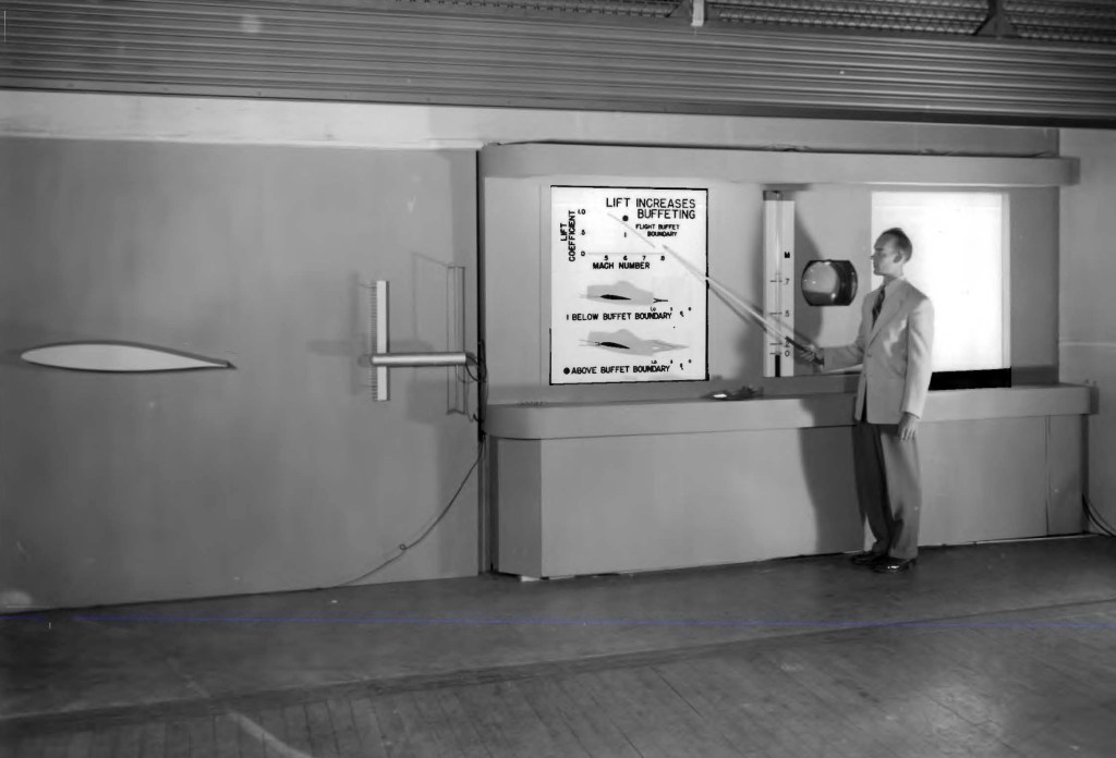 Man pointing to display.