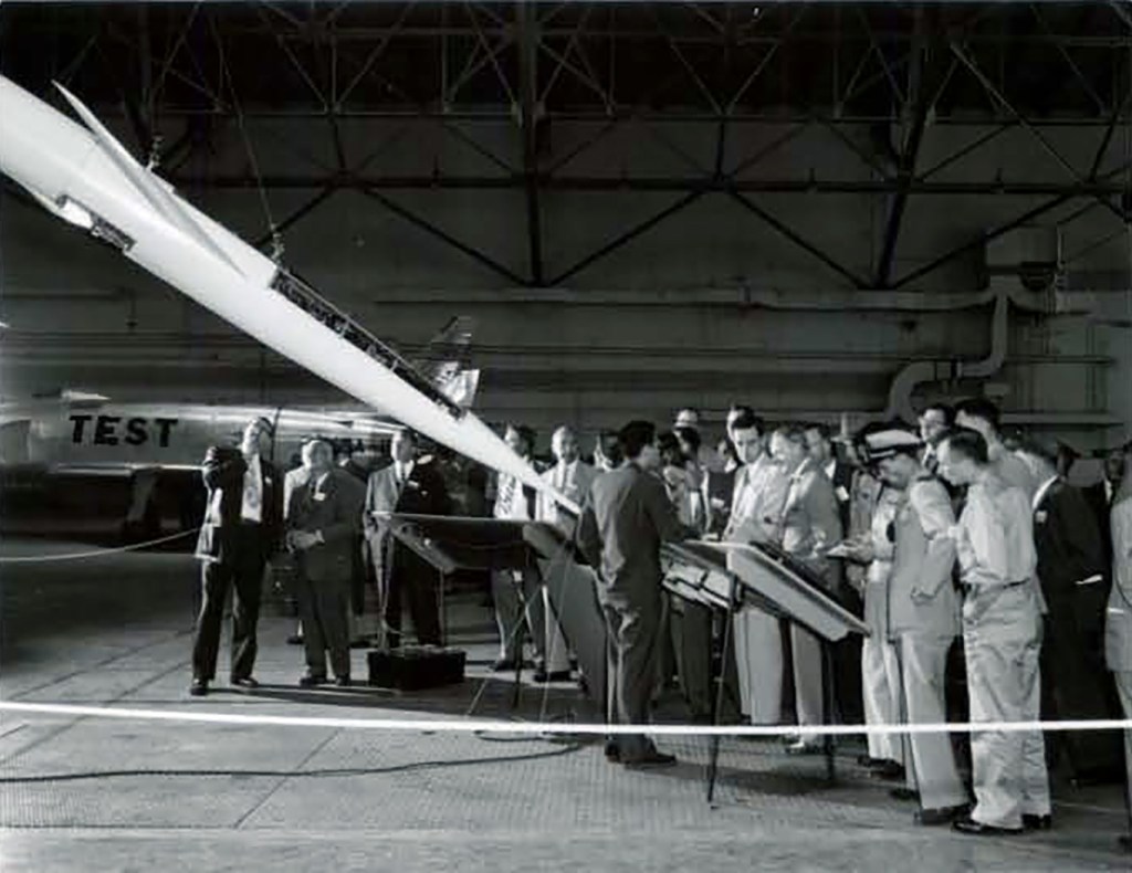 Group in hangar.