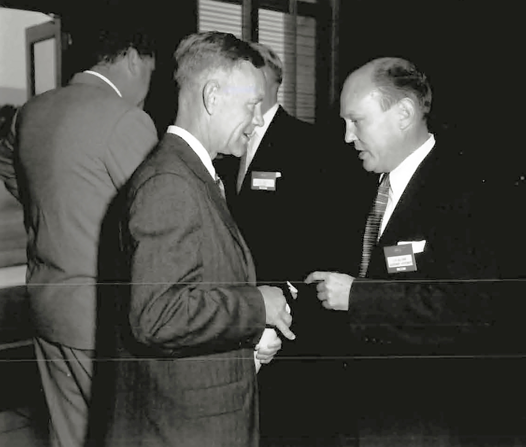 Two men talking.