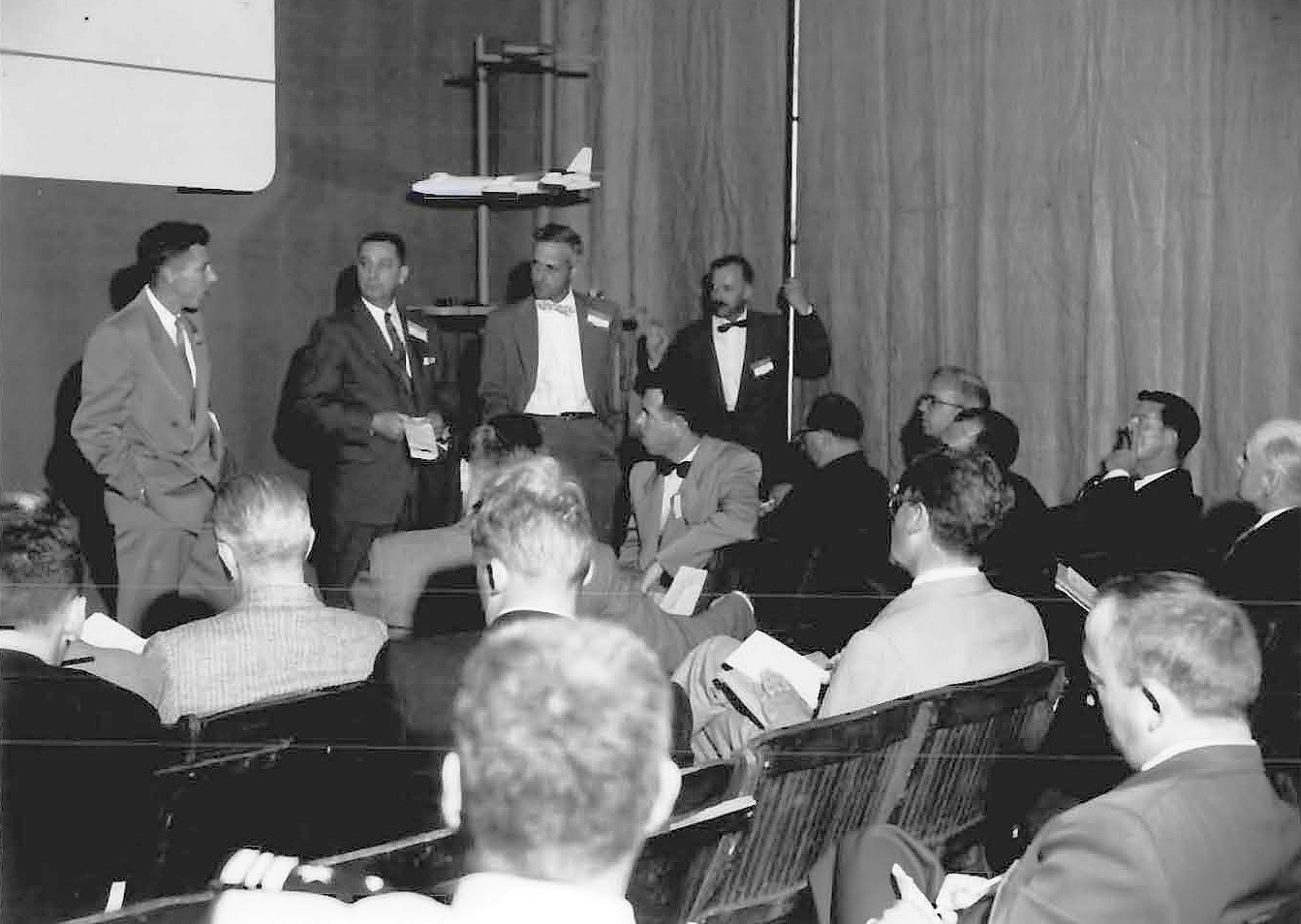 Group of men talking.
