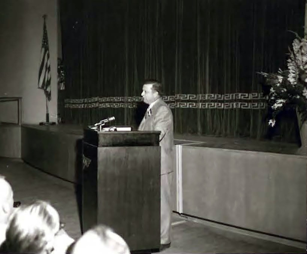 Man at podium.