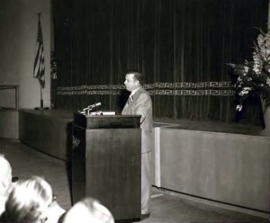 Man at podium.