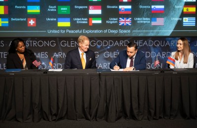 Four officials at an Artemis Accords signing event