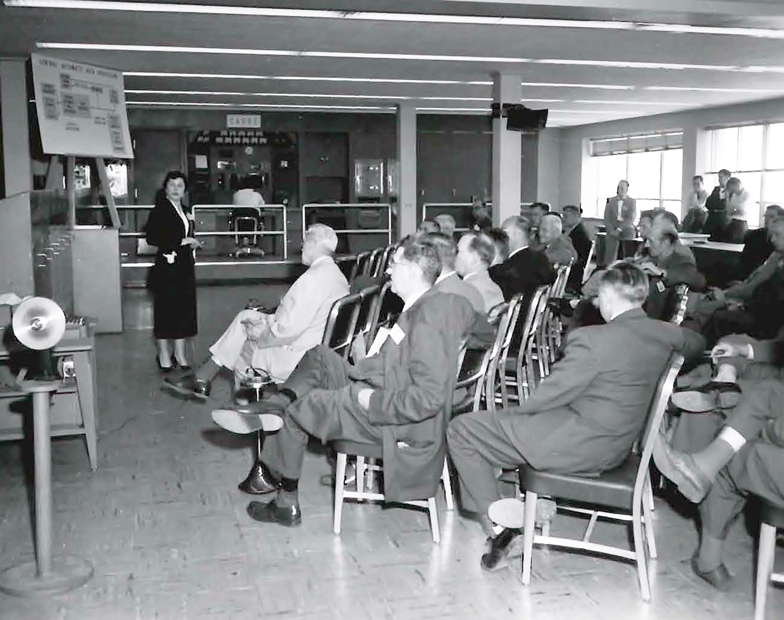 Woman speaking to group.
