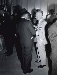 Two men talking.