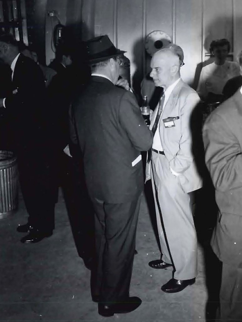 Two men talking.