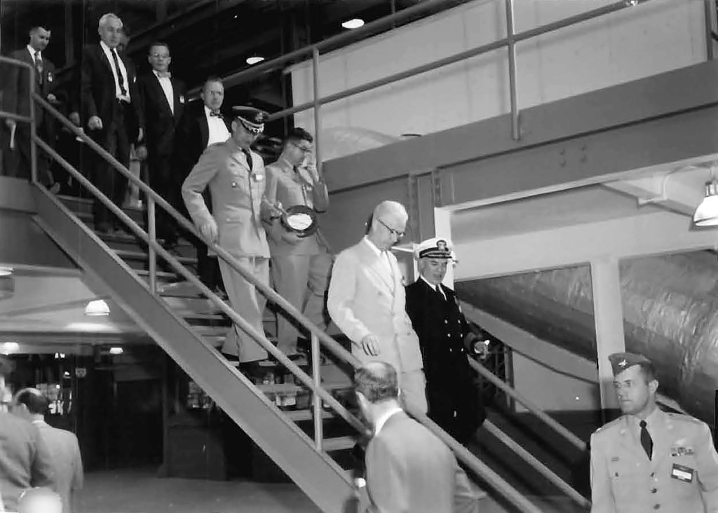 Men descending staircase.