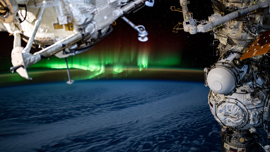 An aurora swirls above the Indian Ocean in this photograph from the International Space Station as it orbited 266 miles above Earth.
