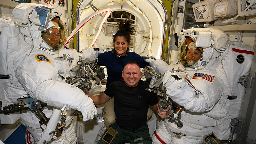 NASA's Boeing Crew Flight Test astronauts Suni Williams and Butch Wilmore (at center) pose with Expedition 71 Flight Engineers (far left) Mike Barratt and Tracy C. Dyson (far right), both NASA astronauts, in their spacesuits.