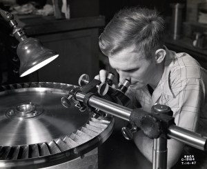 Man looking at compressor