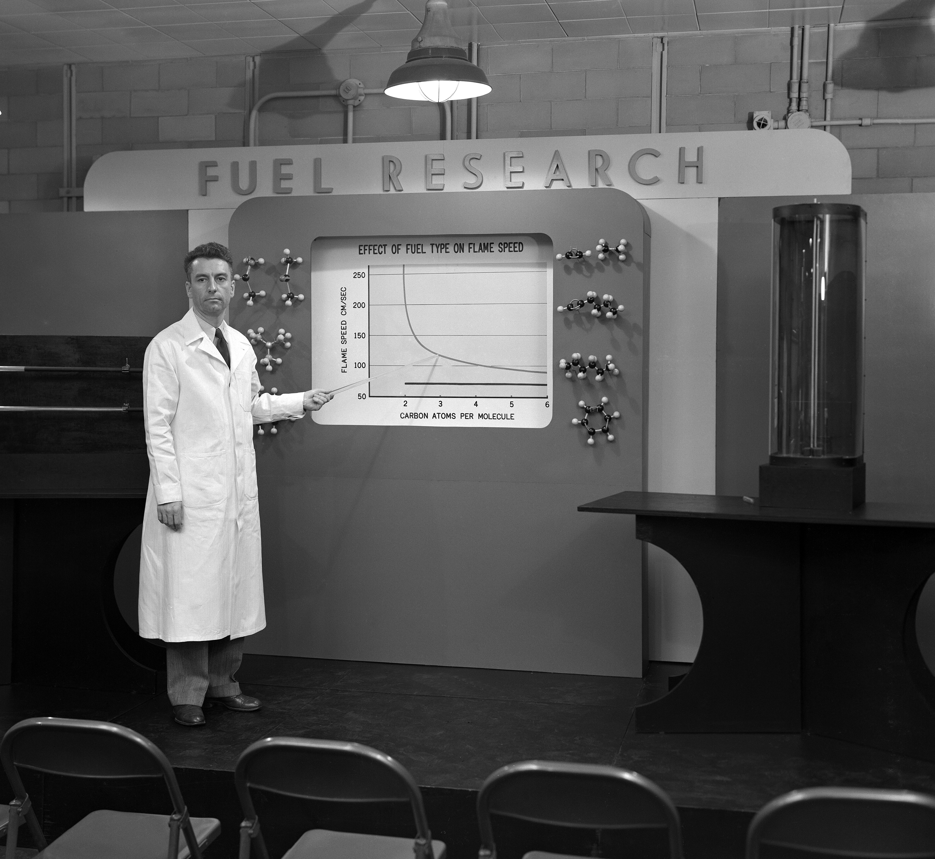 Man pointing to display.