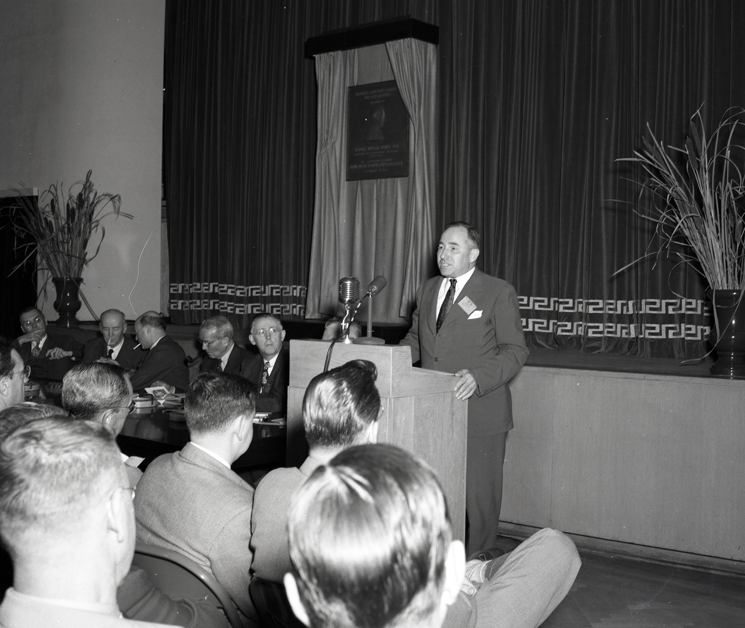 Man speaking at podium.