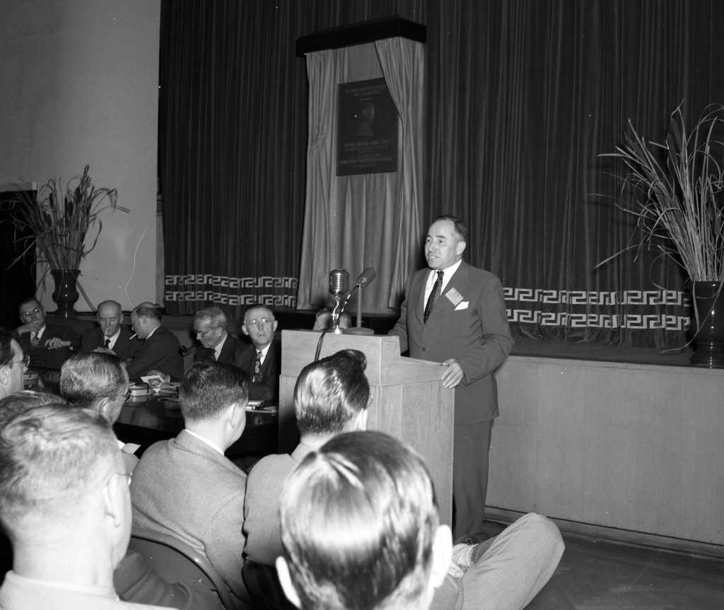 Man speaking at podium.