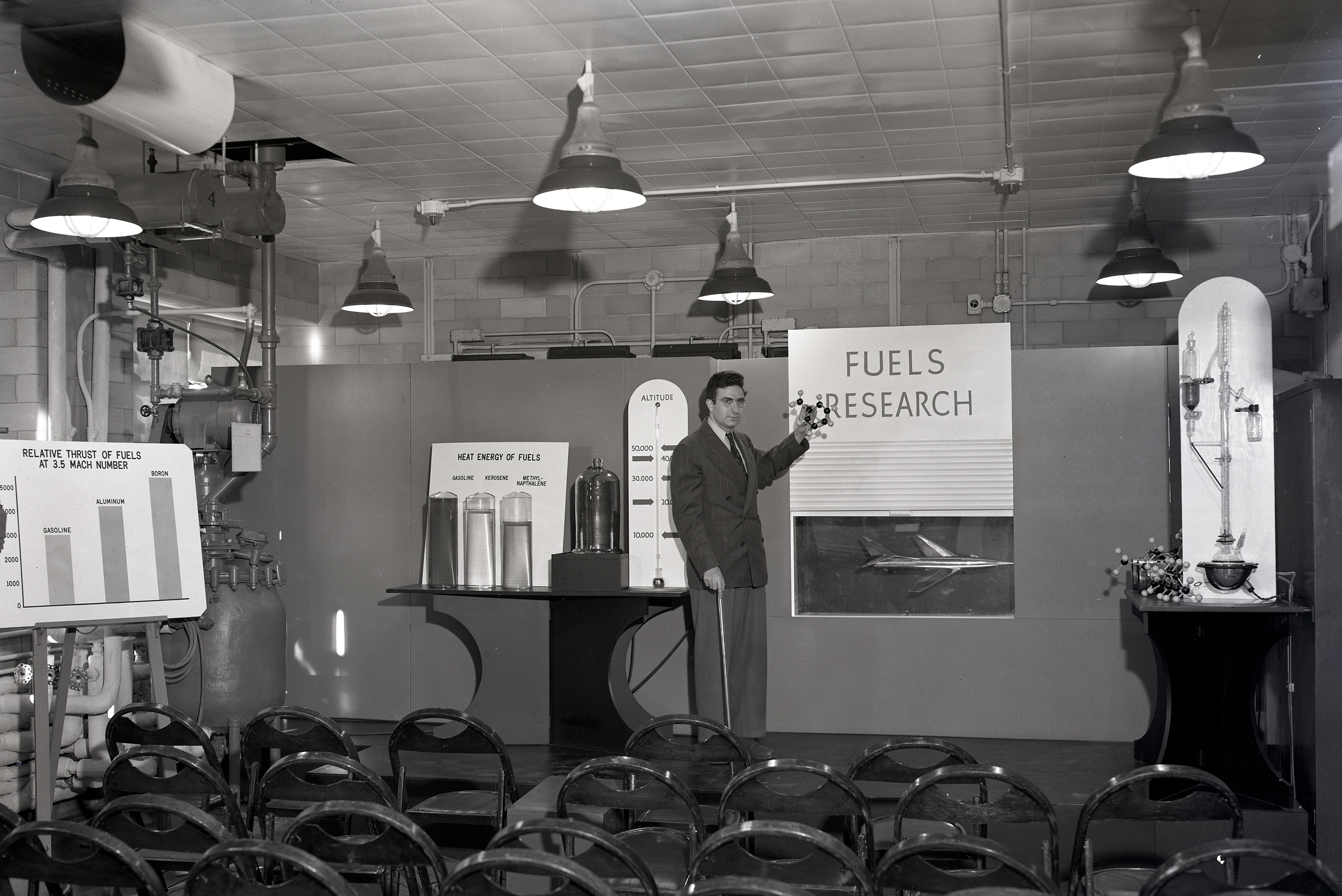 Man pointing to exhibit.