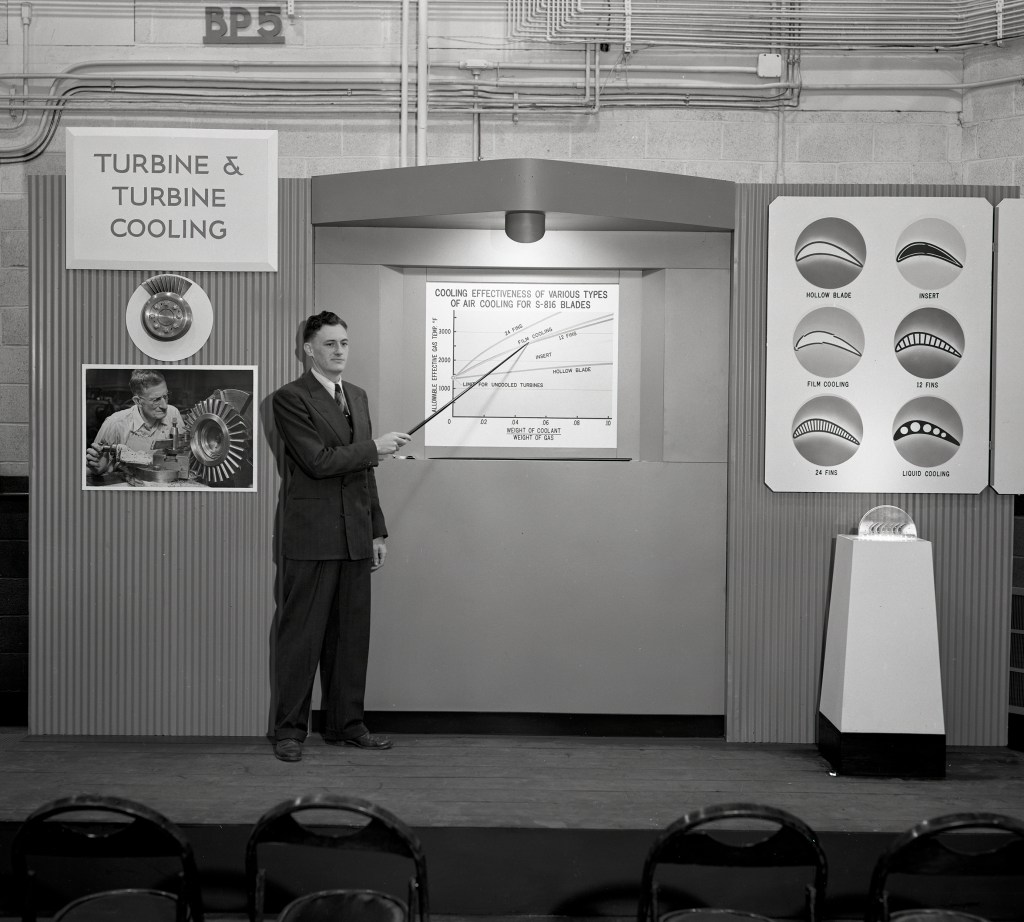 Man pointing to exhibit.
