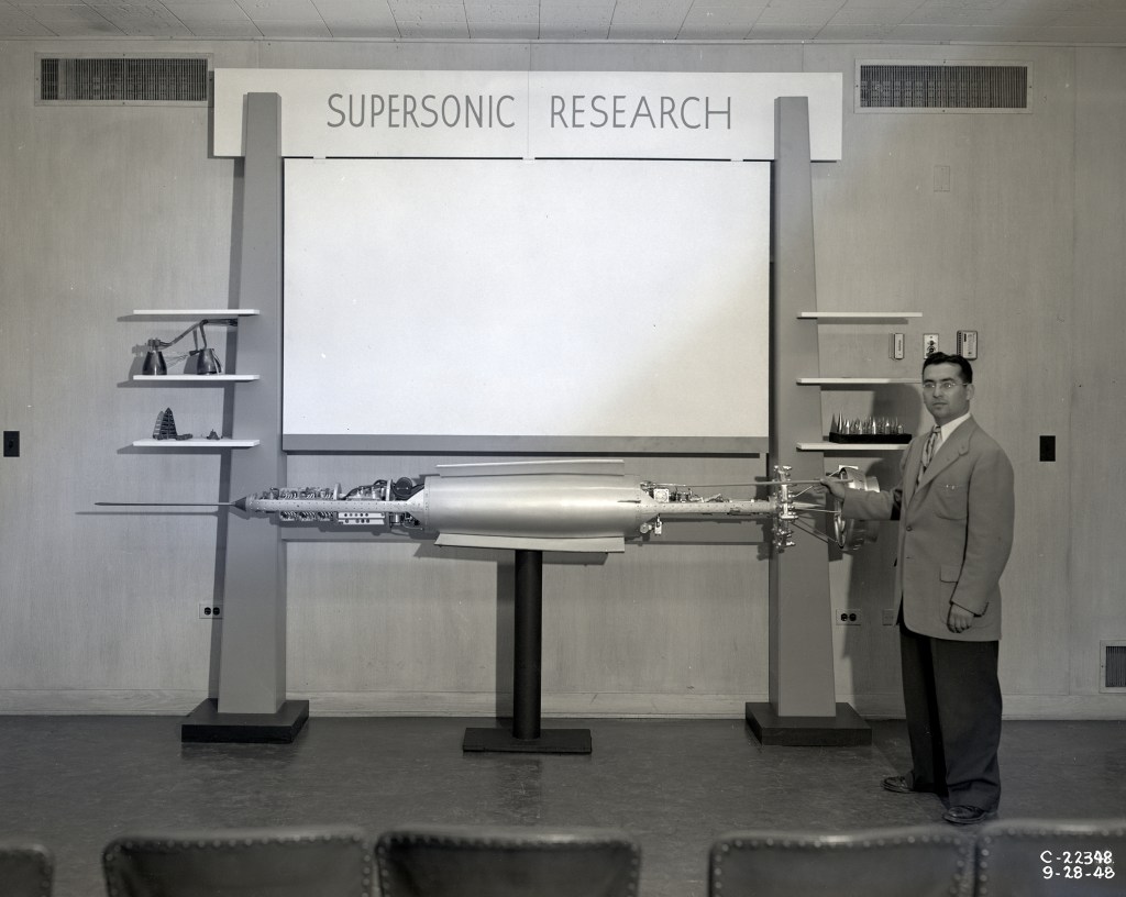 Man pointing to exhibit.