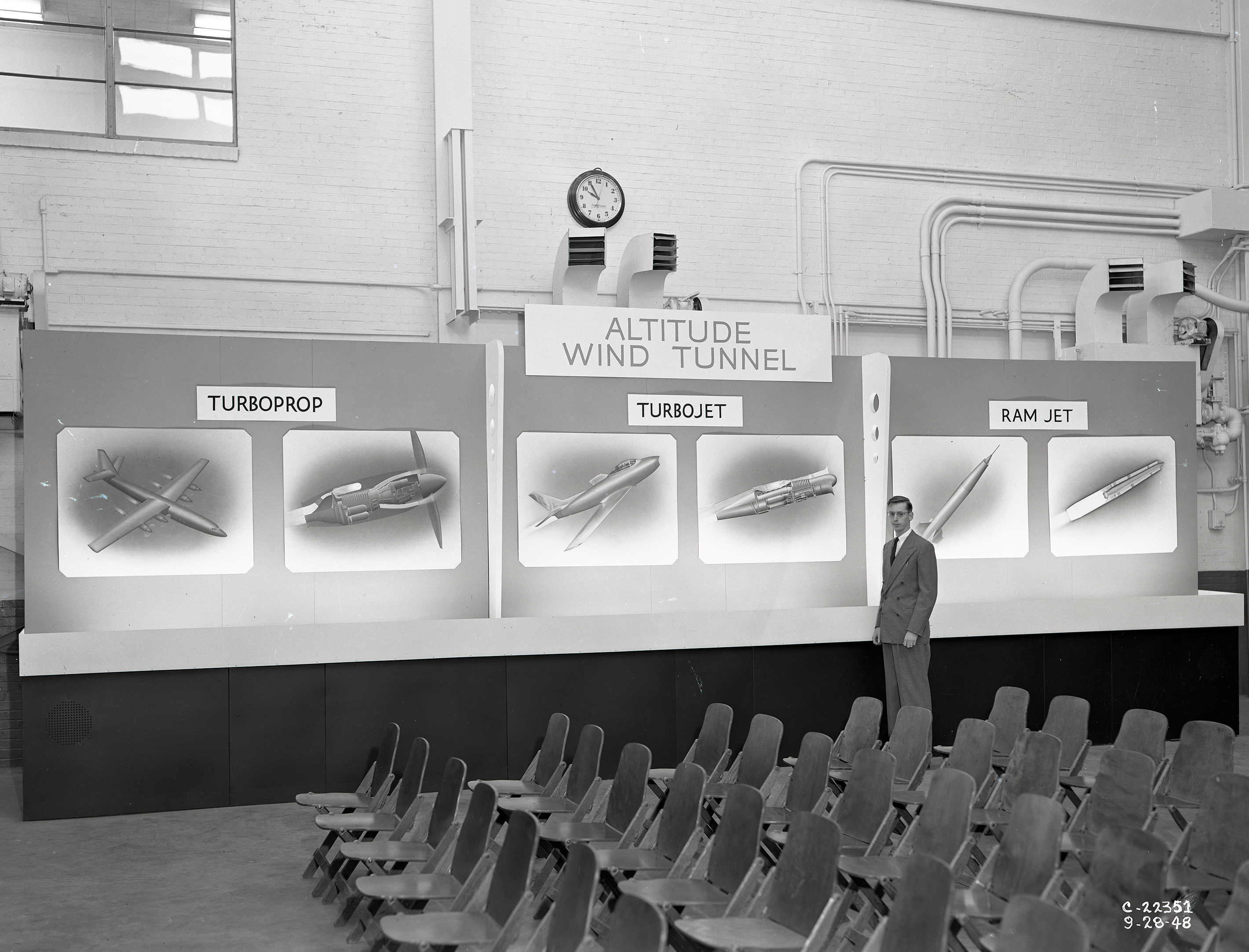 Man pointing to exhibit.