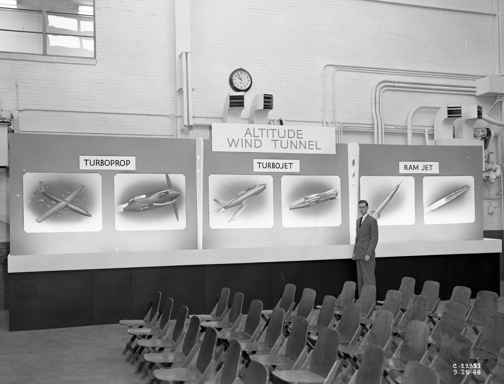 Man pointing to exhibit.