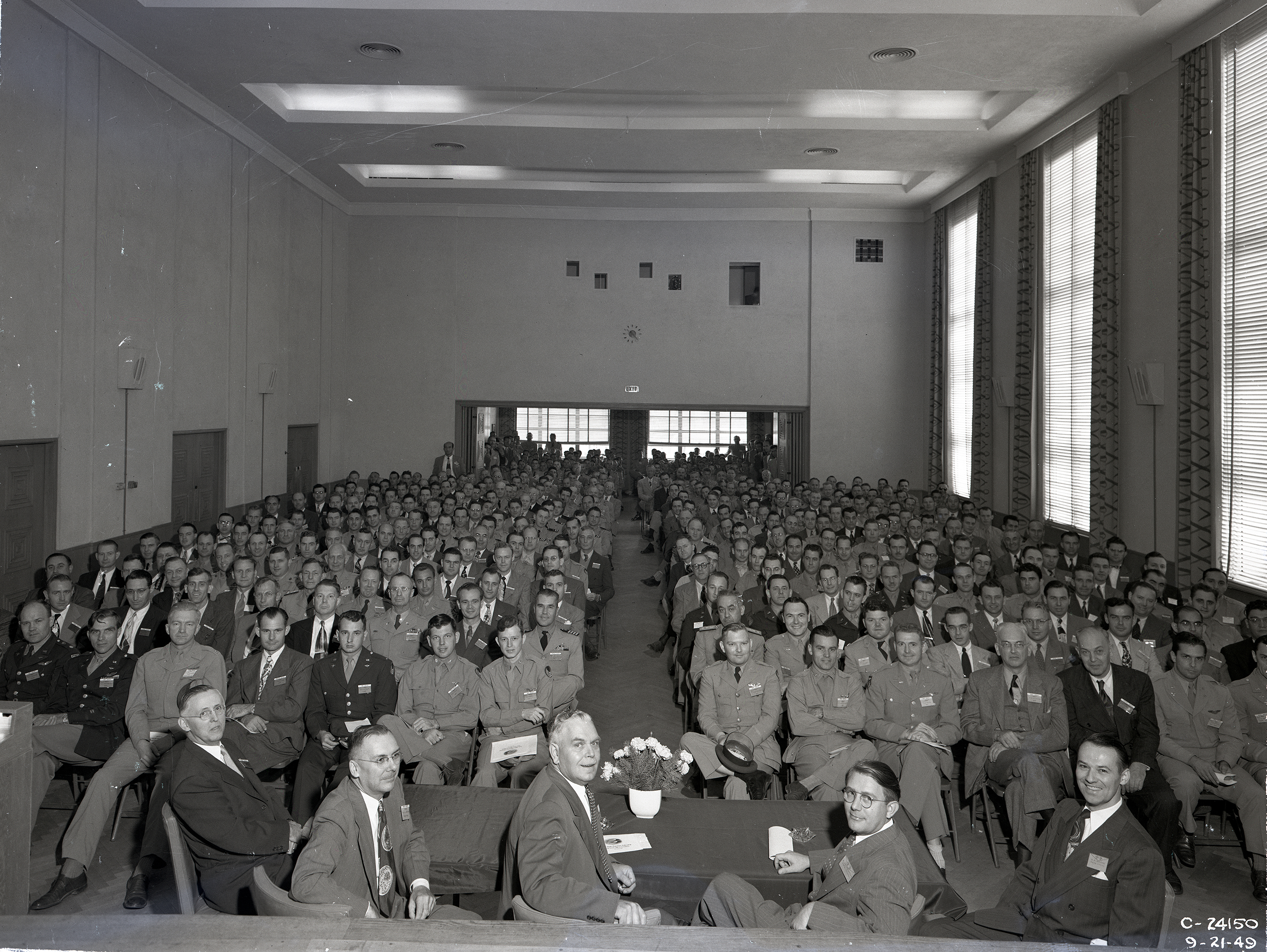 Group seated in auditorium.