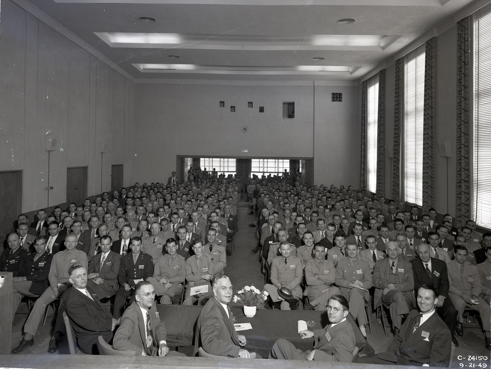 Group seated in auditorium.