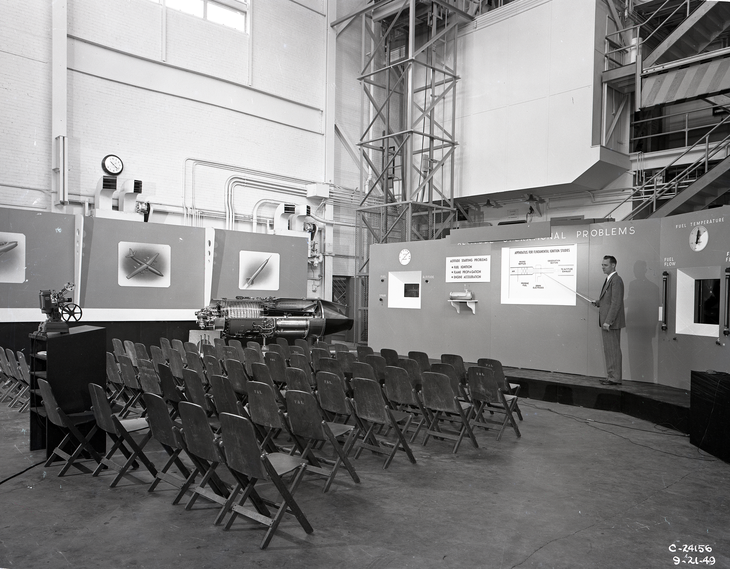Empty chairs at exhibit.