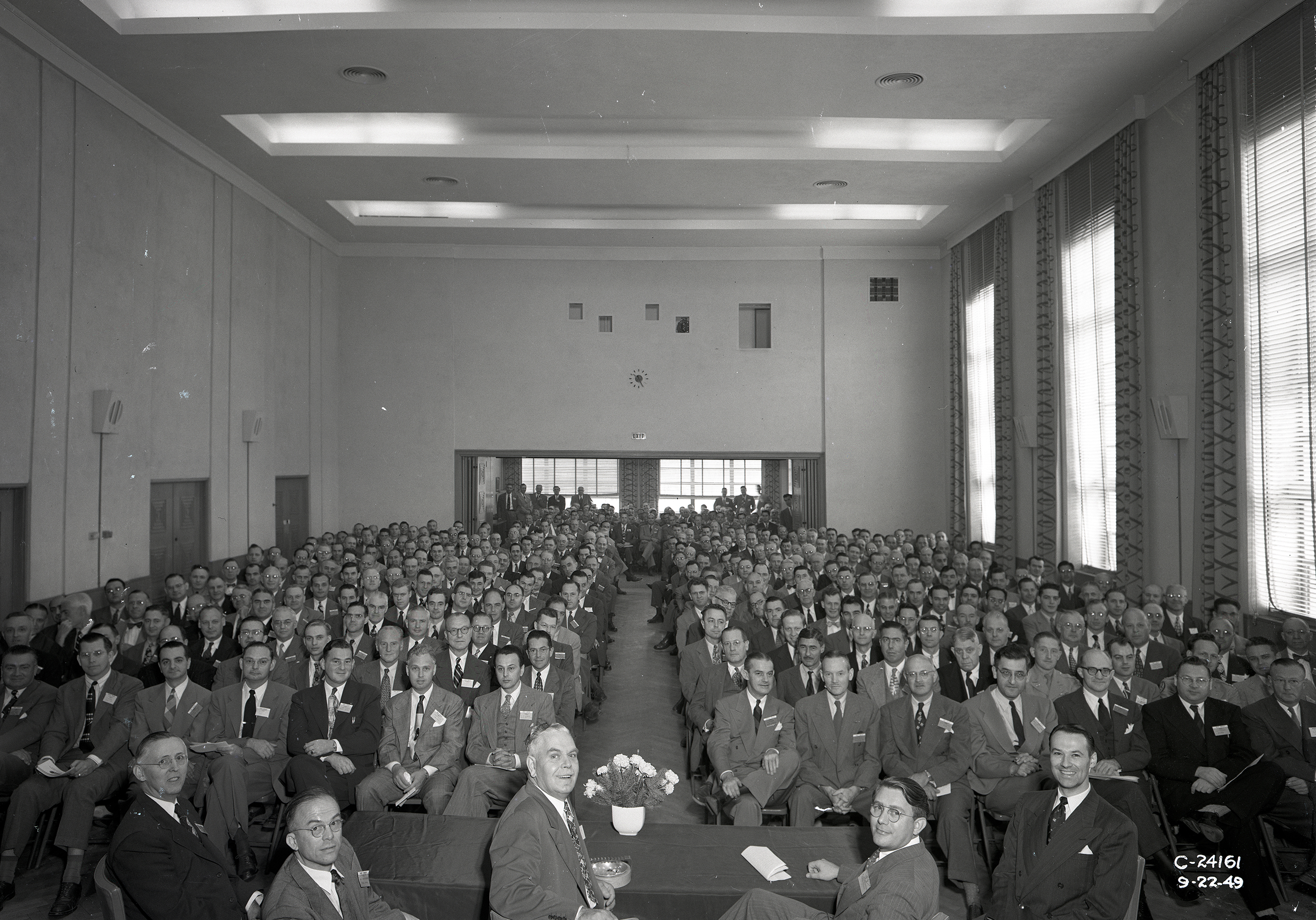 Group seated in auditorium.