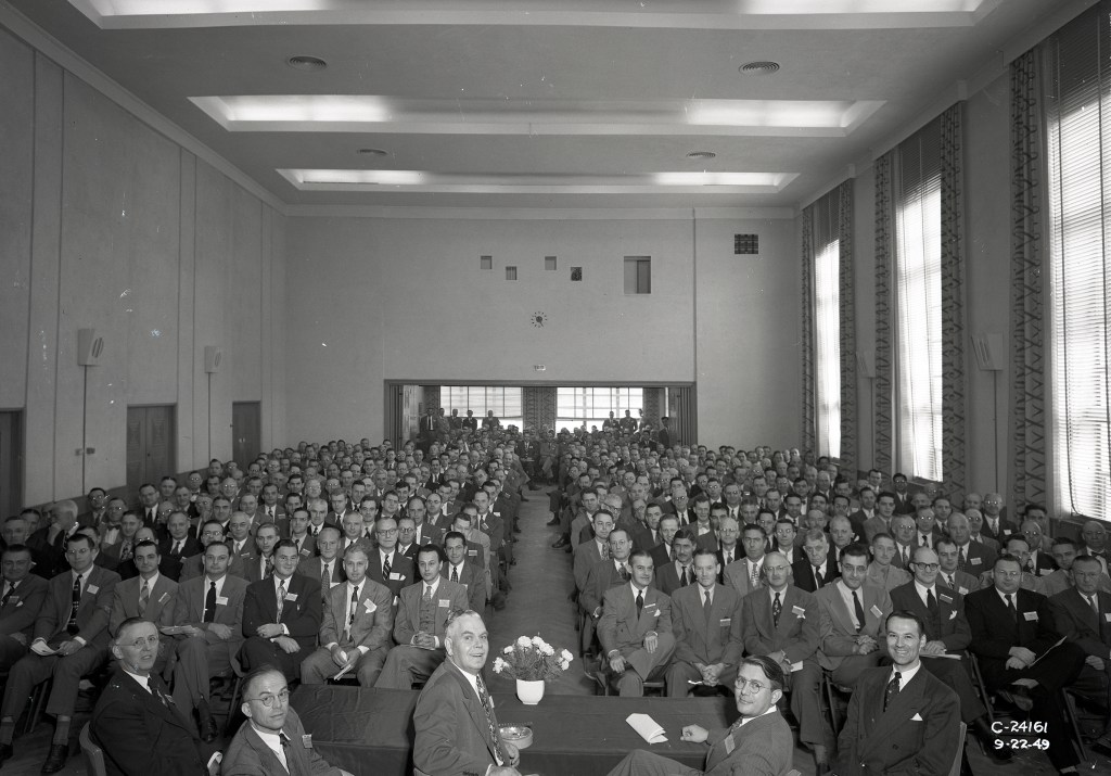 Group seated in auditorium.