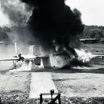 Aircraft on runway with smoke.
