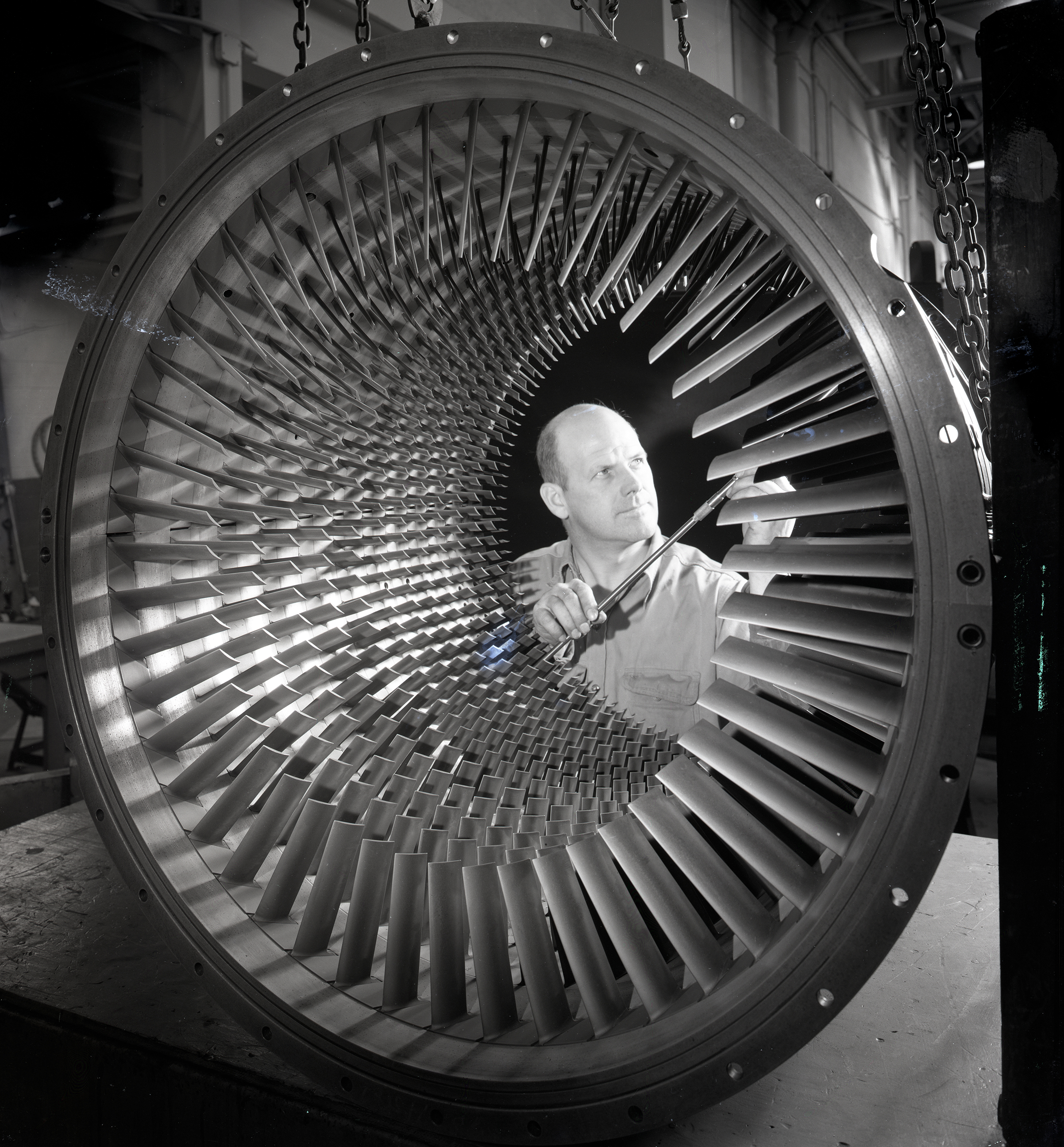 Man looking at compressor.
