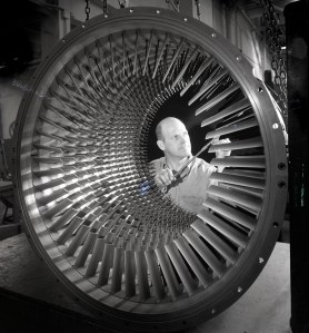 Man looking at compressor.