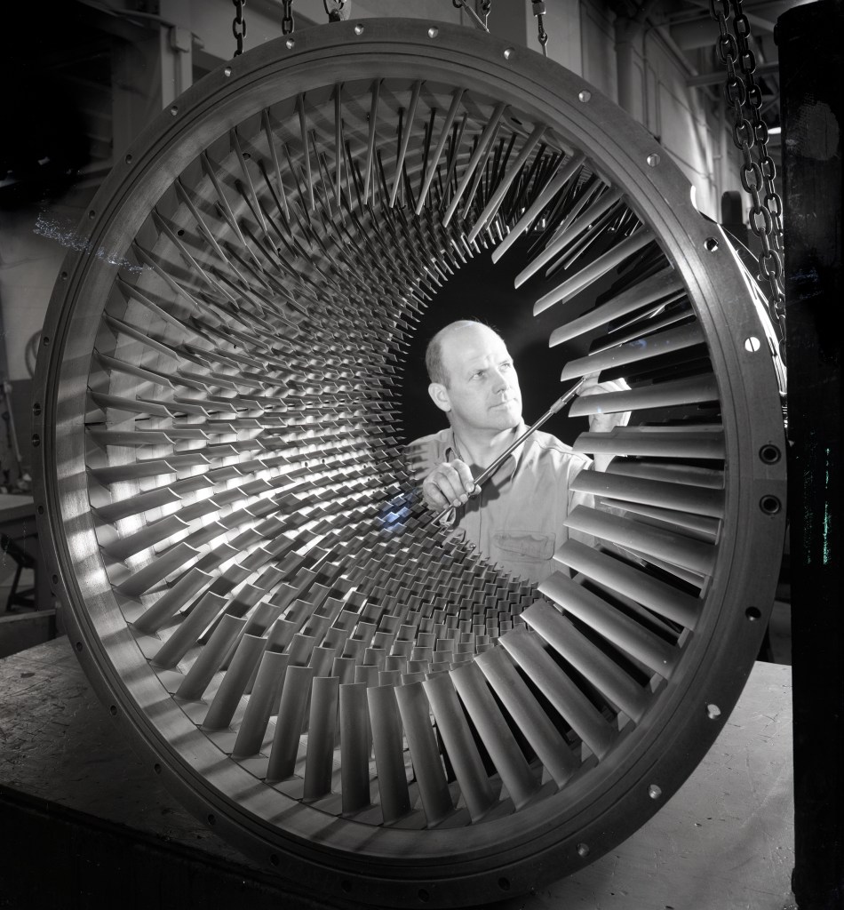 Man looking at compressor.