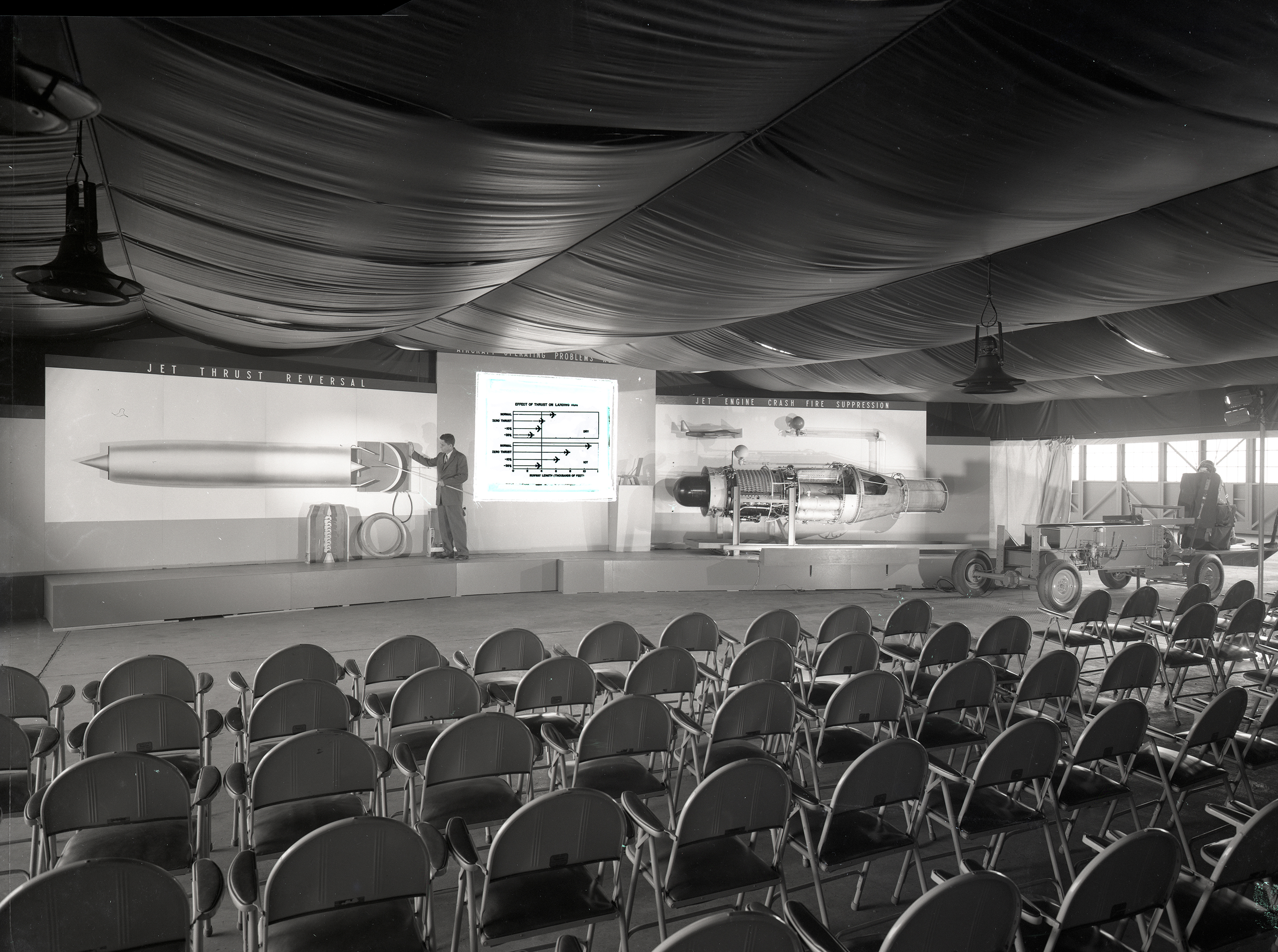 Chairs set up in front of display.