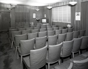 Empty seats in conference room.