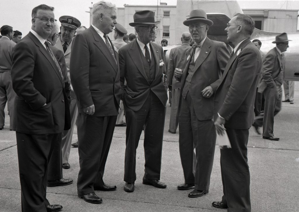 Four men standing.