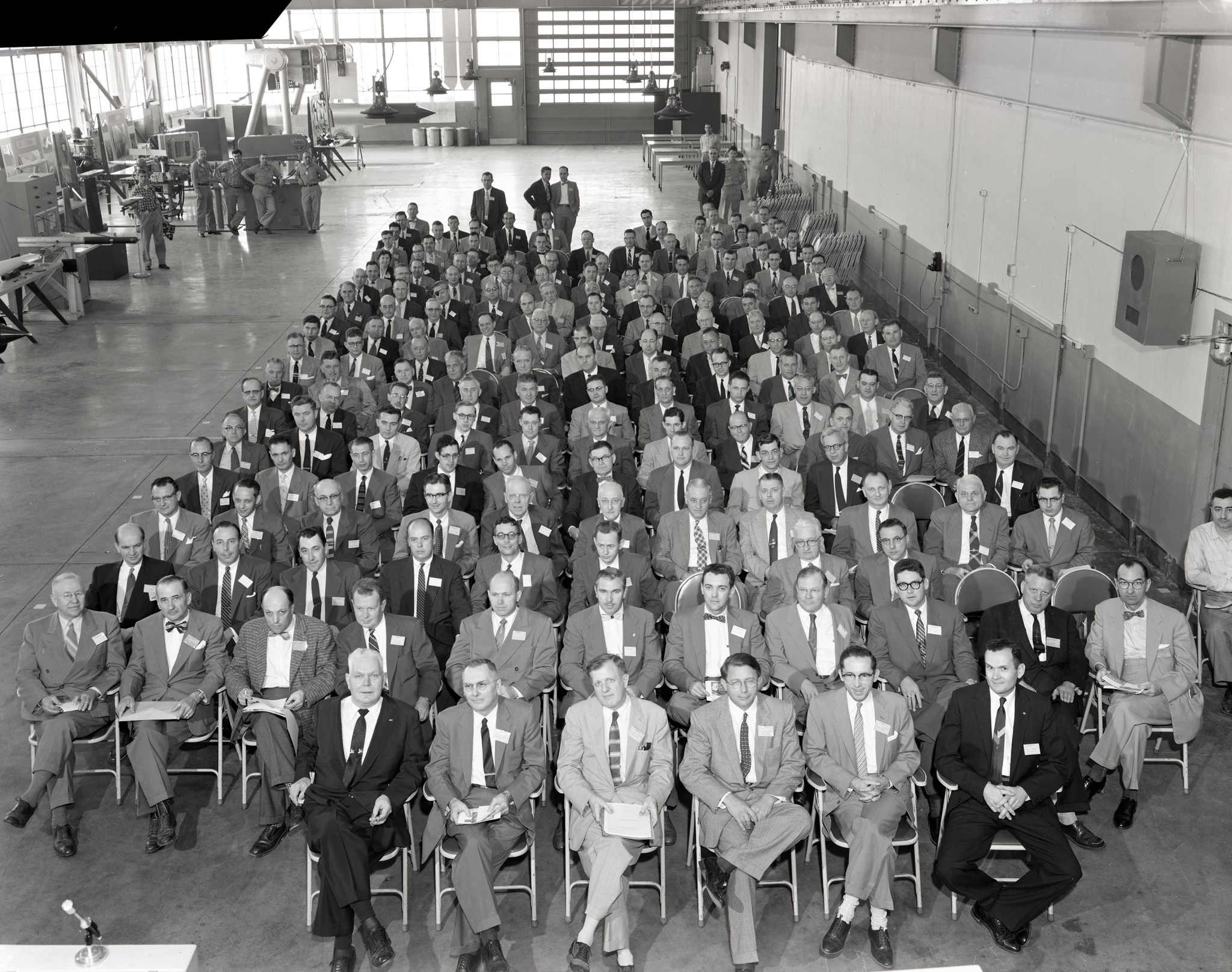 Group seated in shop area.