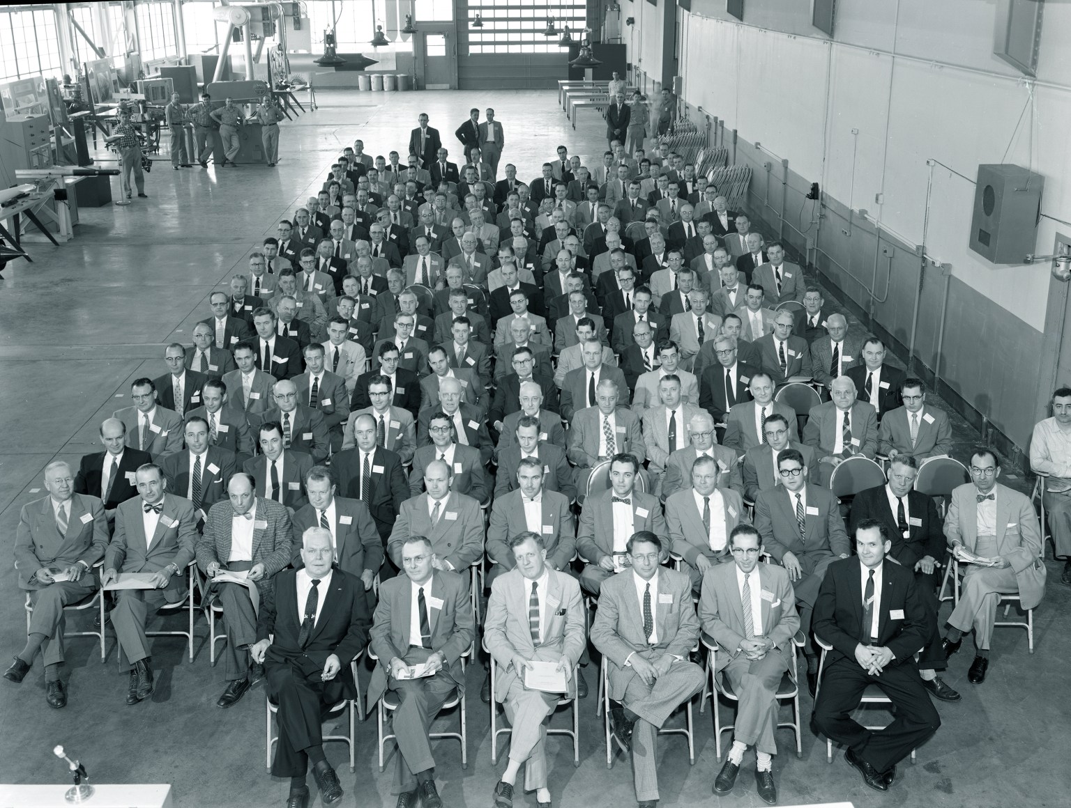 Group seated in shop area.