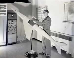 Man with missile model.
