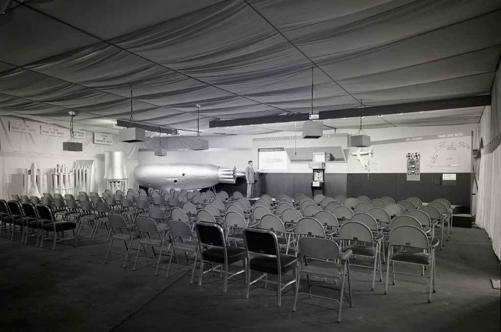 Empty chairs by exhibit.
