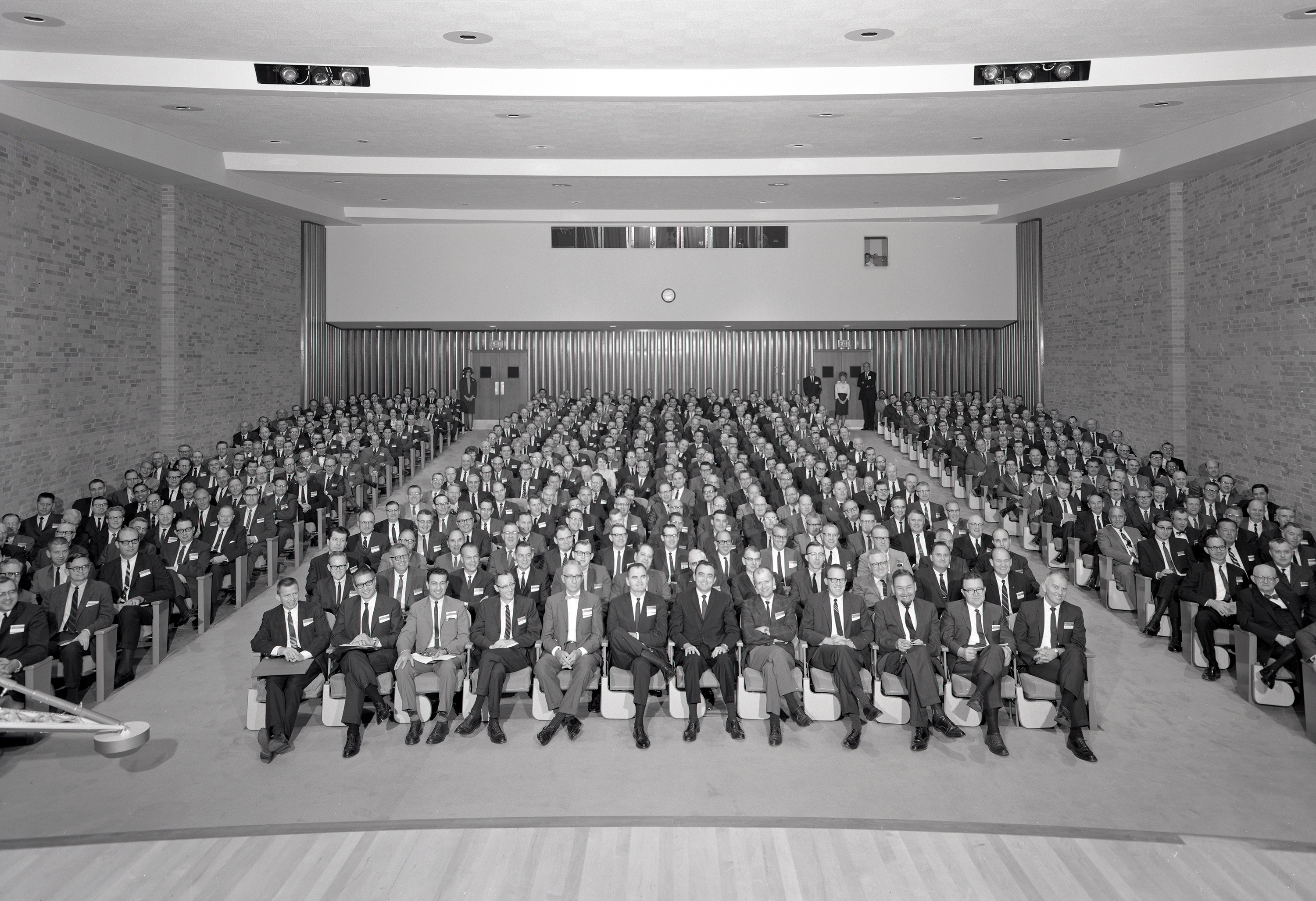 Group seated in auditorium.