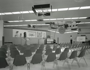 Empty seats in front of exhibit.