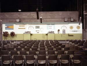 Empty seats in front of exhibit.