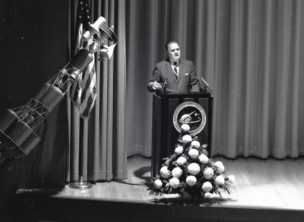Man at podium.