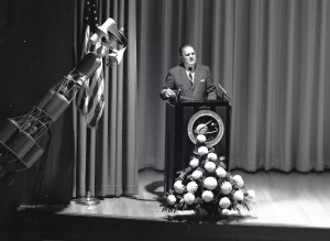 Man at podium.