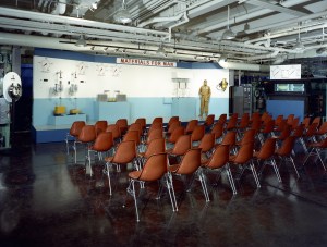 Empty chairs at exhibit.